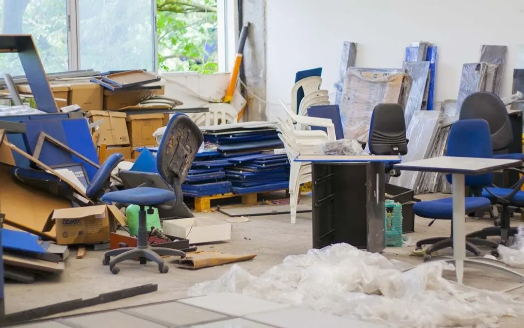 A worn metal tool cabinet and workshop storage items